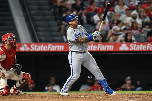 The Kansas City Royals’ Salvador Perez hits a three-run double...