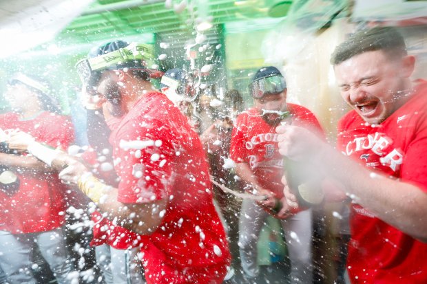 Boston Red Sox outfielder Wilyer Abreu (middle) celebrates with teammates after defeating the Detroit Tigers in a baseball game to advance to the post season, Friday, Sept. 26, 2025, in Boston. (AP Photo/Greg M. Cooper)