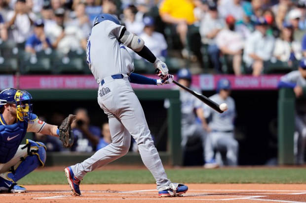 Dodgers Shohei Ohtani doubles against the Seattle Mariners during a...