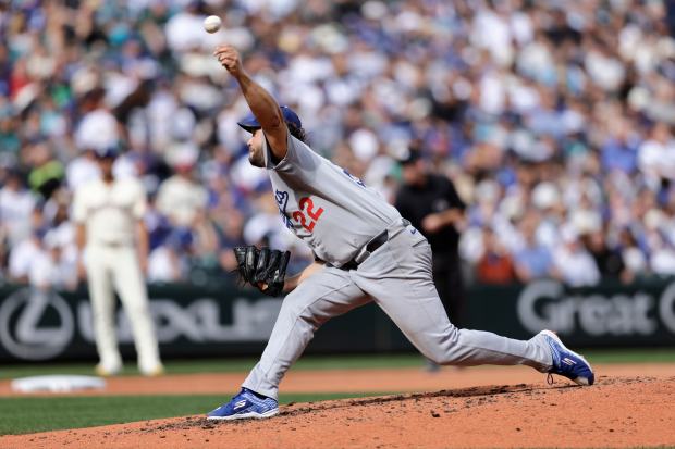 Dodgers pitcher Clayton Kershaw throws against the Seattle Mariners during...