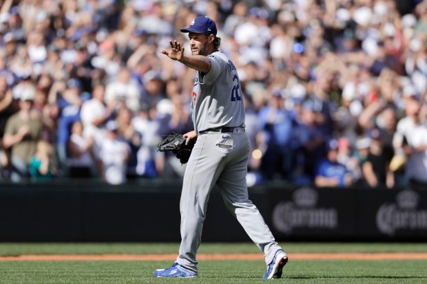 Dodgers pitcher Clayton Kershaw waves as he leaves during the...