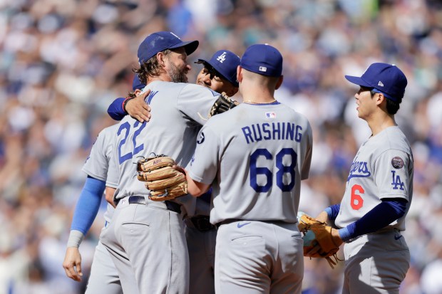 Dodgers pitcher Clayton Kershaw (22) reacts as he is replaced...