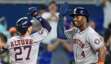 Houston Astros' Jose Altuve celebrates after hitting a two-run homer that brought home Jesus Sanchez (4), in the first inning of a baseball game against the Miami Marlins, Tuesday, Aug. 5, 2025, in Miami. (AP Photo/Rebecca Blackwell)
