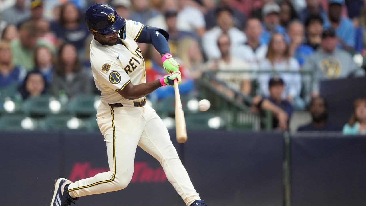 Milwaukee Brewers' Andruw Monasterio hits an RBI single during the third inning of a baseball game against the Arizona Diamondbacks, Monday, Aug. 25, 2025, in Milwaukee.