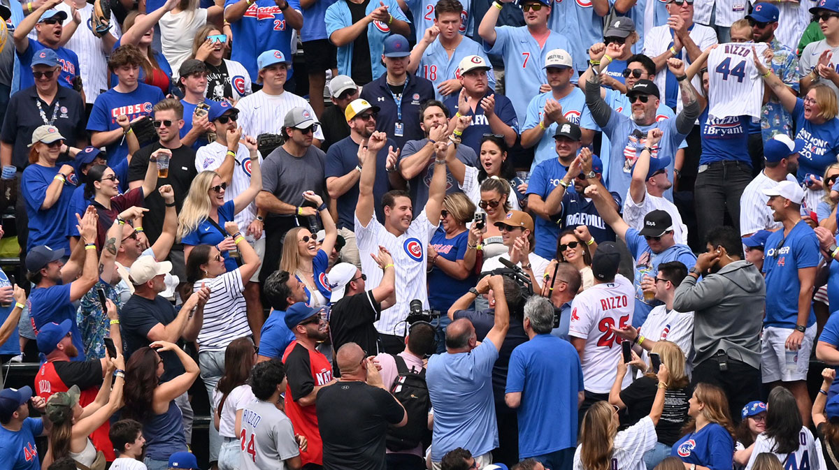 Anthony Rizzo former Chicago Cubs player and team ambassador is recognized while sitting in the bleachers during a game against the Tampa Bay Rays at Wrigley Field.