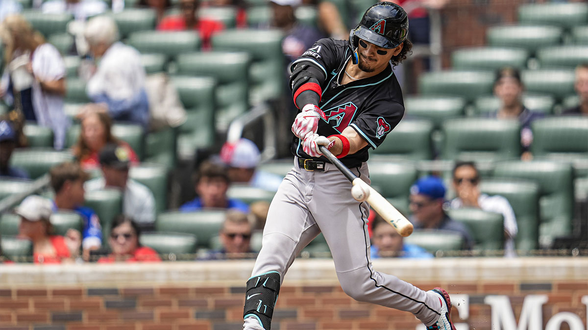 Arizona Diamondbacks center fielder Alek Thomas (5) gets a base hit against the Atlanta Braves during the third inning at Truist Park.