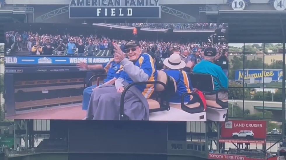 Veterans appear on the jumbotron at American Family Field.