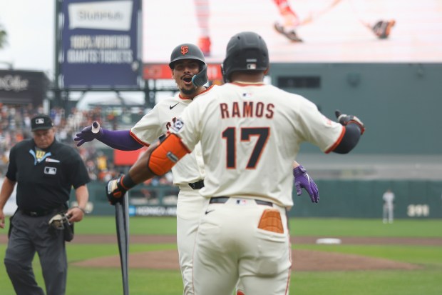 Willy Adames #2 of the San Francisco Giants celebrates with Heliot Ramos #17 after hitting a solo home run in the bottom of the first inning against the Colorado Rockies at Oracle Park on Sept. 28, 2025 in San Francisco, California. (Photo by Lachlan Cunningham/Getty Images)