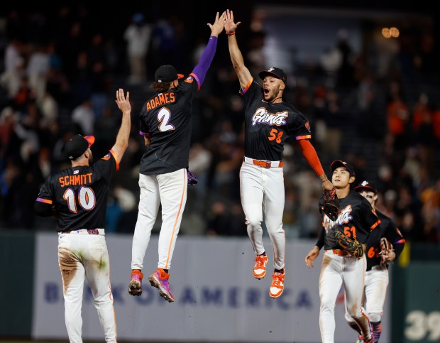 San Francisco Giants' Willy Adames (2) and San Francisco Giants'...