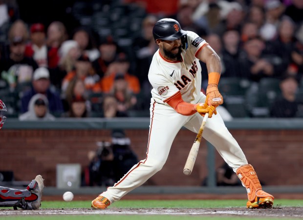 San Francisco Giants’ Jerar Encarnacion #59 strikes out against St....