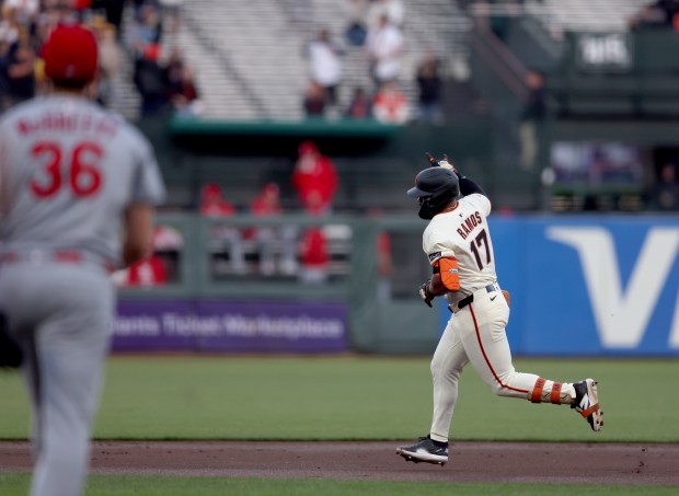 San Francisco Giants’ Heliot Ramos #17 gestures as he rounds...