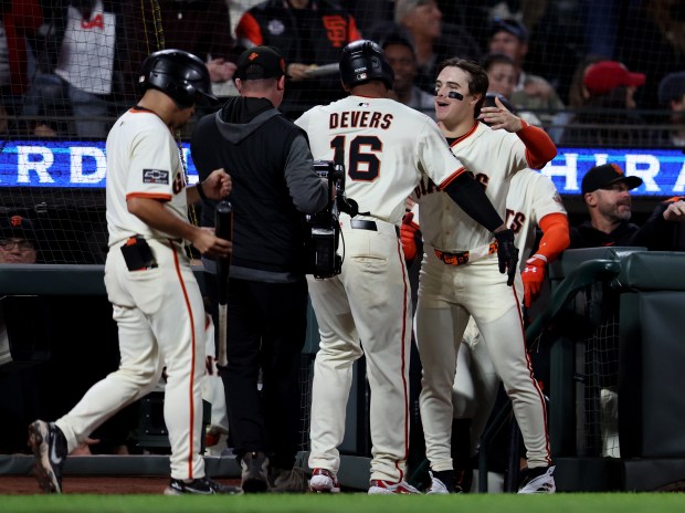 San Francisco Giants’ Rafael Devers #16 bat as he celebrates...