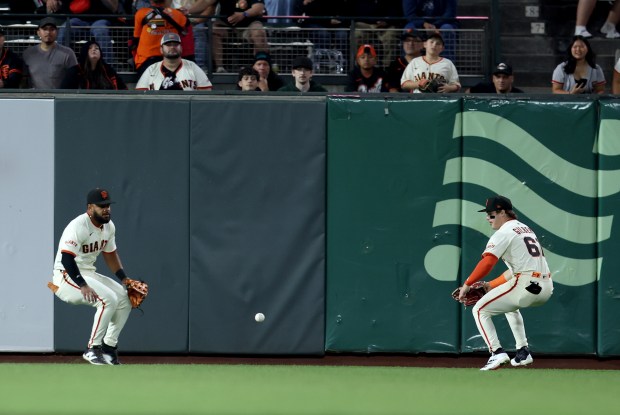 San Francisco Giants left fielder Heliot Ramos #17 and center...