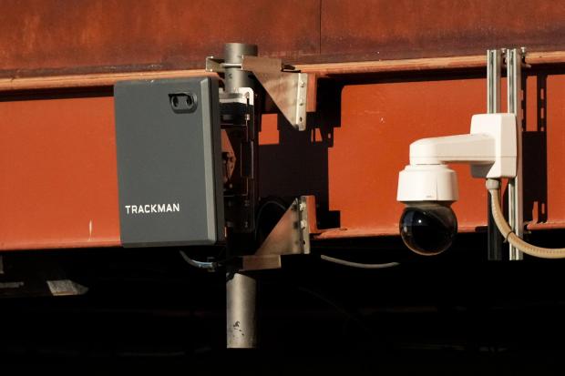 A Trackman device used for the Automated Ball-Strike System is posted on the balcony behind home plate before a spring training game on Feb. 22, 2025, in Phoenix. (AP Photo/Ashley Landis)