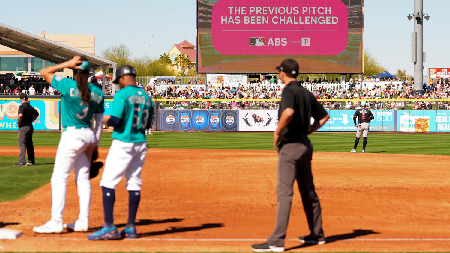 FILE - An outfield screen shows a graphic indicating Seattle Mariners' Julio Rodriguez challenged a...