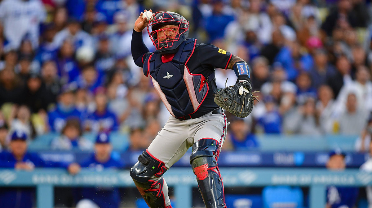 Atlanta Braves catcher Drake Baldwin (30) throws to first for the out against Los Angeles Dodgers first baseman Enrique Hernandez (8) during the fourth inning at Dodger Stadium.