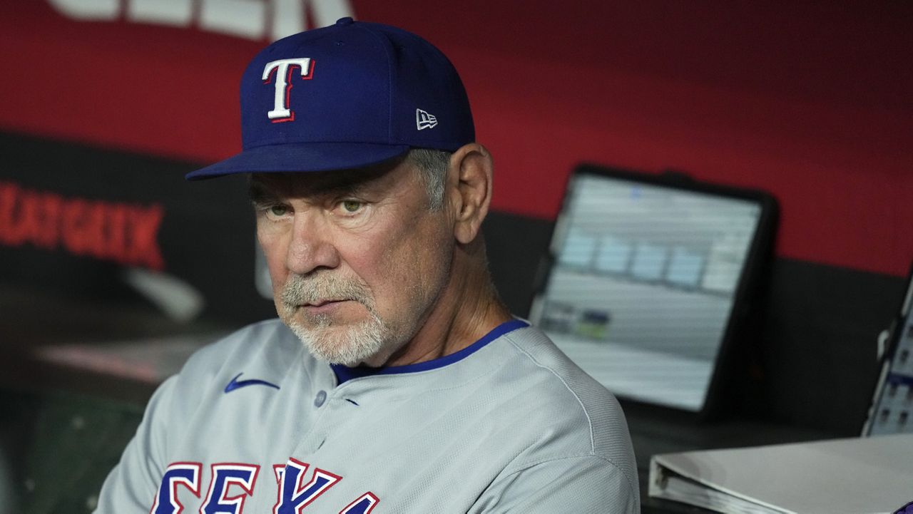 Texas Rangers manager Bruce Bochy pauses in the team dugout prior to a baseball game against the Arizona Diamondbacks Tuesday, Sept. 2, 2025, in Phoenix. (AP Photo/Ross D. Franklin)