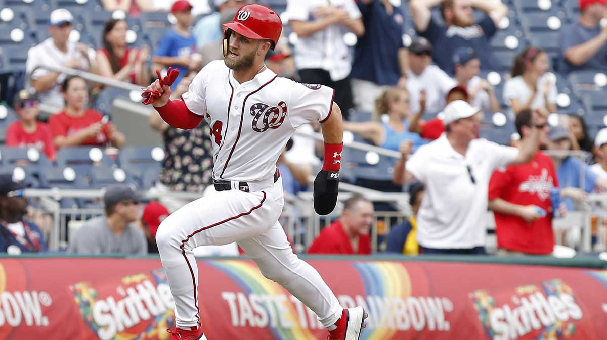 Aug 7, 2018; Washington, DC, USA; Washington Nationals right fielder Bryce Harper (34) scores a run on a two-run double by Washington Nationals first baseman Ryan Zimmerman (not pictured) against the Atlanta Braves in the sixth inning at Nationals Park. The Nationals won 8-3. 