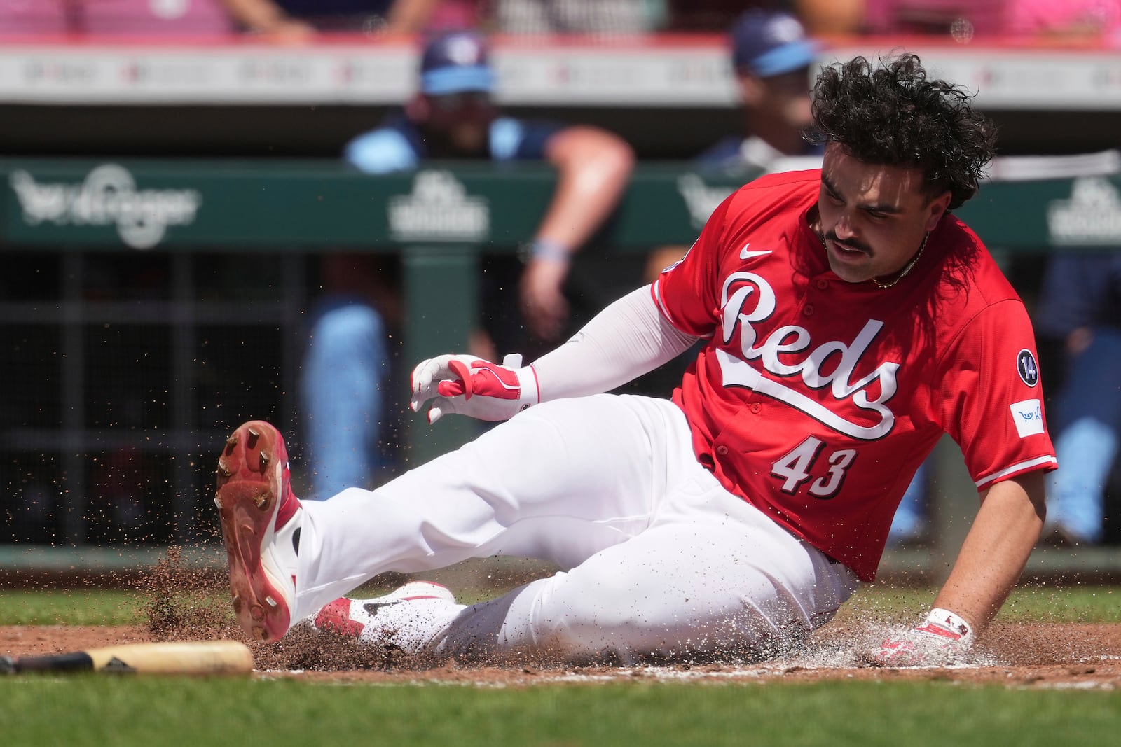 Cincinnati Reds' Sal Stewart scores a run in the second inning of a baseball game against the Toronto Blue Jays, Monday, Sept. 1, 2025, in Cincinnati. (AP Photo/Kareem Elgazzar)