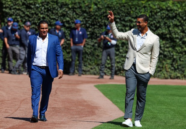 Chicago Cubs Hall of Famers Sammy Sosa, left, and Derrek Lee arrive at Wrigley Field before their on-field celebration on Sept. 7, 2025, in Chicago. (Stacey Wescott/Chicago Tribune)