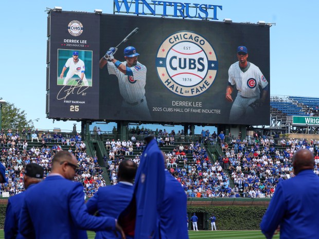 Chicago Cubs Hall of Famers watch a video highlighting Derrek Lee at Wrigley Field on Sept. 7, 2025, in Chicago. (Stacey Wescott/Chicago Tribune)