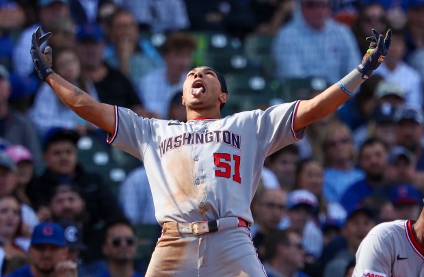 Washington Nationals outfielder Daylen Lile (51) celebrates a triple off of Chicago Cubs pitcher Daniel Palencia (48) in the top of the ninth inning at Wrigley Field on Sept. 7, 2025, in Chicago. Lile went two for four. (Stacey Wescott/Chicago Tribune)