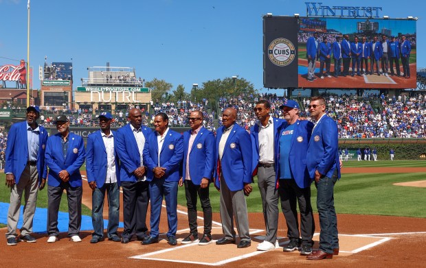 Chicago Cubs Hall of Famers, left to right: Lee Smith, Billy Williams, Shawon Dunston, Andre Dawson, Sammy Sosa, Aramis Ramirez, Fergie Jenkins, Derrek Lee, Rick Sutcliffe, and Kerry Wood, pose for a photo at Wrigley Field on Sept. 7, 2025, in Chicago. (Stacey Wescott/Chicago Tribune)