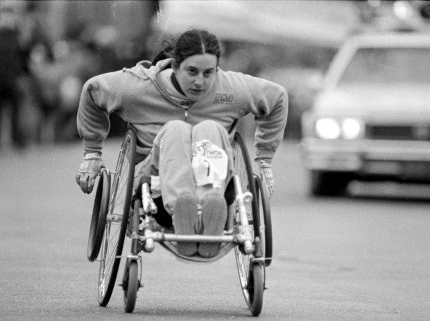 Gloved hands keep Jayne Schiff of Chicago speeding along in her racing wheelchair on April 5, 1981, at a 10,000-meter course on the Chicago lakefront. In 1980, she was the first unofficial wheelchair winner of the Chicago Marathon. (Ernie Cox Jr./Chicago Tribune)