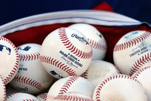 Baseballs used in practice at Wrigley Field in Chicago on Monday, Sept. 29, 2025, are gathered up as the Cubs get ready to face the Padres in a wild-card playoff series starting on Tuesday. (Terrence Antonio James/Chicago Tribune)