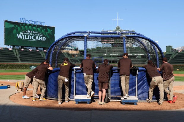 San Diego Padres watch teammates take batting practice at Wrigley Field in Chicago on Monday, Sept. 29, 2025, as the team gets ready to face the Cubs in a wild-card playoff series starting on Tuesday. (Terrence Antonio James/Chicago Tribune)