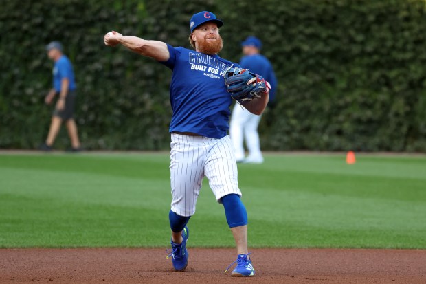 Chicago Cub Justin Turner throws a ball during practice at Wrigley Field in Chicago on Monday, Sept. 29, 2025, as the team gets ready to face the Padres in a wild-card playoff series starting on Tuesday. (Terrence Antonio James/Chicago Tribune)