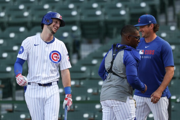 Cubs right fielder Kyle Tucker laughs with teammates while working out during batting practice before a game against the Mets at Wrigley Field on Sept. 25, 2025, in Chicago. (John J. Kim/Chicago Tribune)