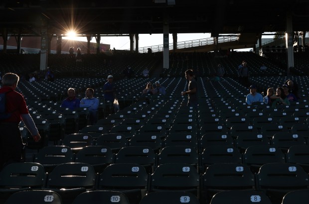 The sun descends toward the horizon before a Cubs-Mets game at Wrigley Field on Sept. 25, 2025, in Chicago. (John J. Kim/Chicago Tribune)