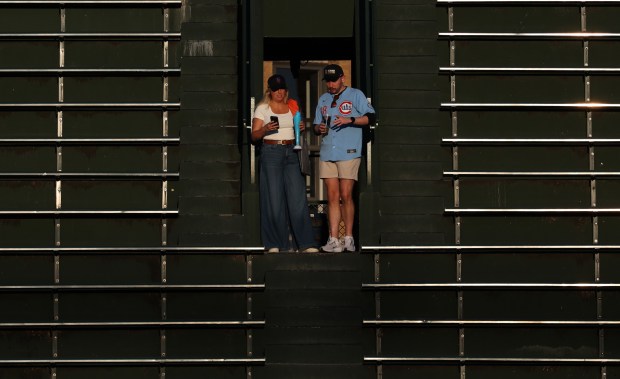 Fans look for their seats in the right-field bleachers before a Cubs-Mets game at Wrigley Field on Sept. 25, 2025, in Chicago.(John J. Kim/Chicago Tribune)