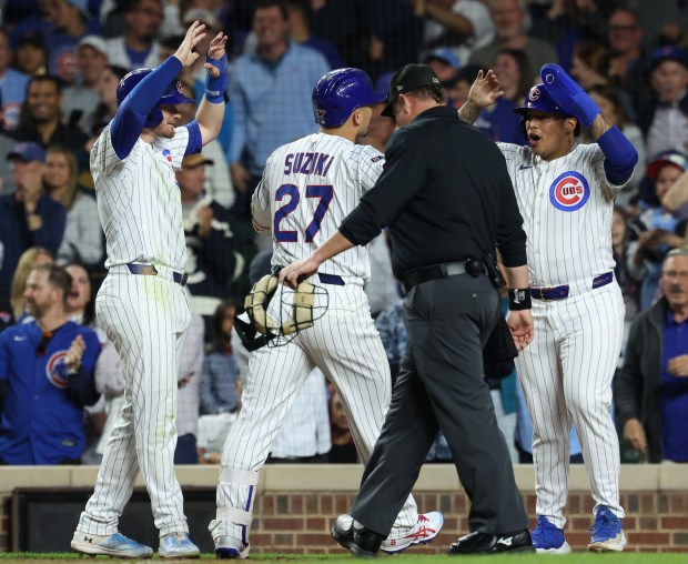 Cubs right fielder Seiya Suzuki is congratulated after hitting a three-run home run in the sixth inning against the Mets at Wrigley Field on Sept. 25, 2025, in Chicago. (John J. Kim/Chicago Tribune)