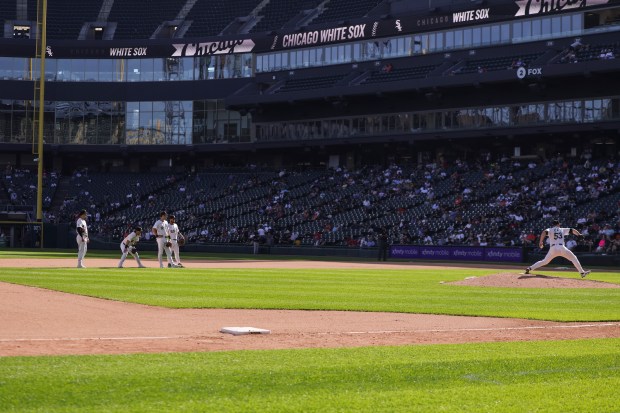 Chicago White Sox infielders watch as Chicago White Sox pitcher Brandon Eisert (53) warms up after being put in during the eighth inning against the Baltimore Orioles at Rate Field on Wednesday, Sept. 17, 2025. (Eileen T. Meslar/Chicago Tribune)