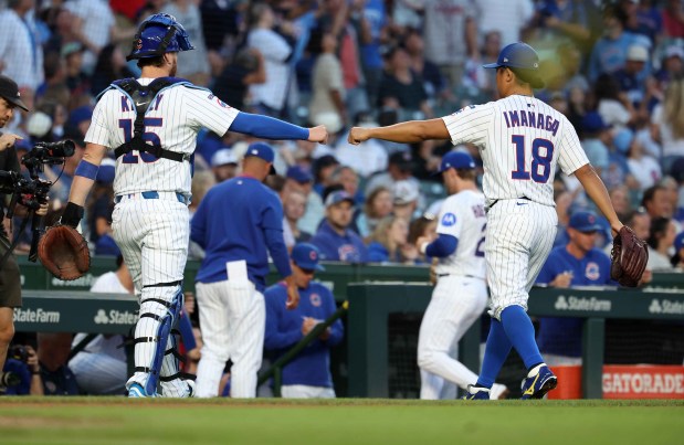 Chicago Cubs catcher Carson Kelly starting pitcher Shota Imanaga (18) congratulate one another after shutting down the Atlanta Braves in the first inning of a game at Wrigley Field in Chicago on Sept. 2, 2025. (Chris Sweda/Chicago Tribune)