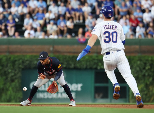 Atlanta Braves second baseman Ozzie Albies fields a ground ball before forcing out Chicago Cubs right fielder Kyle Tucker (30) at second base in the first inning of a game at Wrigley Field in Chicago on Sept. 2, 2025. (Chris Sweda/Chicago Tribune)