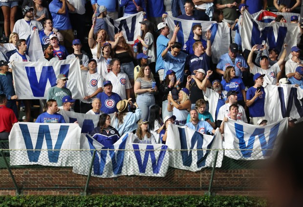 Chicago Cubs fans in the left field bleachers celebrate after a Cubs victory over the Atlanta Braves at Wrigley Field in Chicago on Sept. 2, 2025. (Chris Sweda/Chicago Tribune)