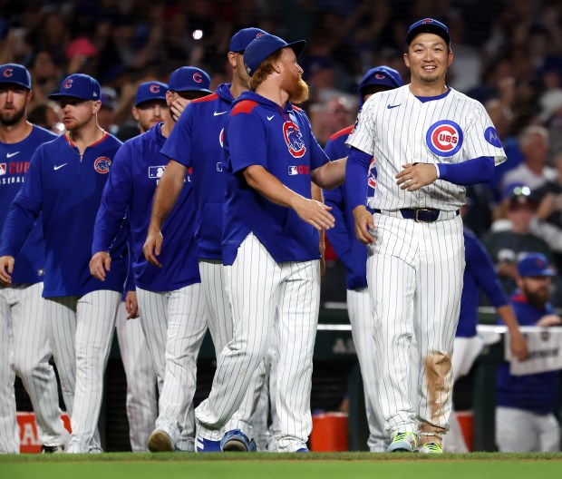 Chicago Cubs designated hitter Seiya Suzuki celebrates with his teammates after a victory over the Atlanta Braves at Wrigley Field in Chicago on Sept. 2, 2025. (Chris Sweda/Chicago Tribune)