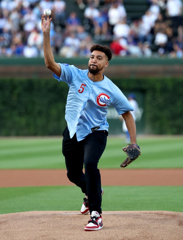 Voice of Wrigley Field announcer Jeremiah Paprocki throws out a ceremonial first pitch before a game between the Chicago Cubs and the Atlanta Braves at Wrigley Field in Chicago on Sept. 2, 2025. (Chris Sweda/Chicago Tribune)