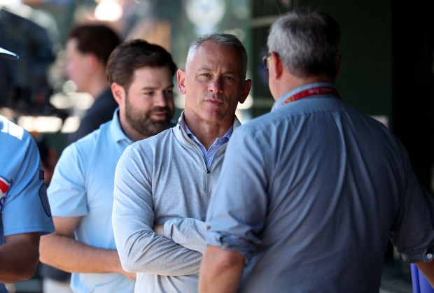 Cubs President Jed Hoyer hangs out in the dugout before a game against the Cardinals on Sept. 26, 2025, at Wrigley Field. (Chris Sweda/Chicago Tribune)