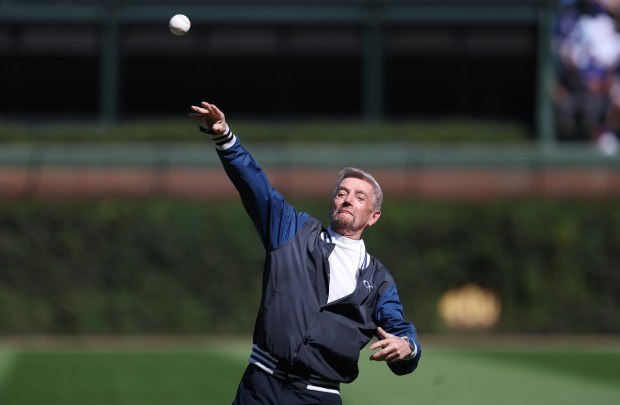 Actor and comedian Tom Dreesen throws a ceremonial first pitch before the start of a game between the Chicago Cubs and the St. Louis Cardinals at Wrigley Field in Chicago on Sept. 26, 2025. (Chris Sweda/Chicago Tribune)