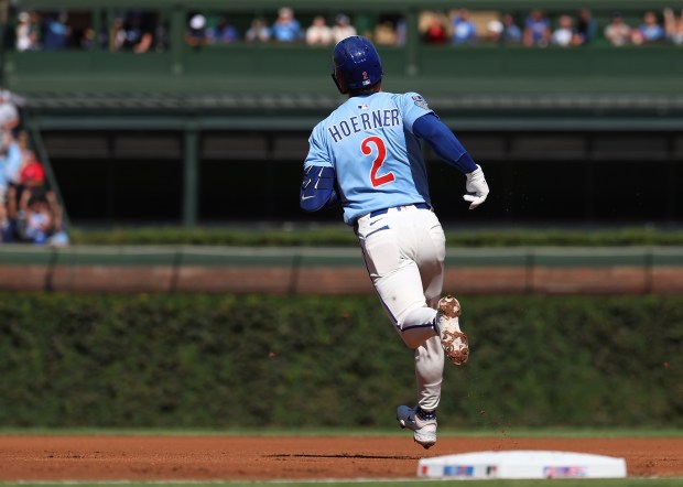 Chicago Cubs second baseman Nico Hoerner rounds the bases after hitting a solo home run in the first inning against the St. Louis Cardinals at Wrigley Field in Chicago on Sept. 26, 2025. (Chris Sweda/Chicago Tribune)