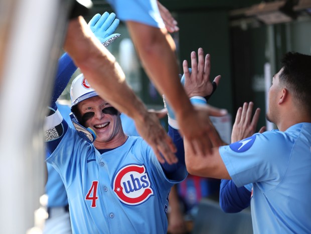 Cubs center fielder Pete Crow-Armstrong high-fives teammates in the dugout after hitting a two-run home run his 30th of the season in the fourth inning against the Cardinals on Sept. 26, 2025, at Wrigley Field. (Chris Sweda/Chicago Tribune)
