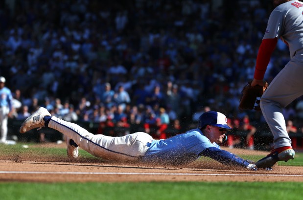 Chicago Cubs third baseman Matt Shaw slides into third base on a run-scoring triple in the seventh inning of a game against the St. Louis Cardinals at Wrigley Field in Chicago on Sept. 26, 2025. (Chris Sweda/Chicago Tribune)