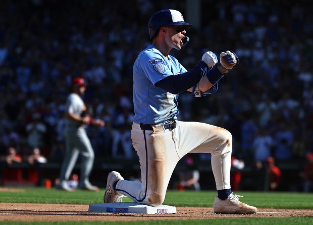 Chicago Cubs third baseman Matt Shaw celebrates at third base after driving in a run on a triple in the seventh inning of a game against the St. Louis Cardinals at Wrigley Field in Chicago on Sept. 26, 2025. (Chris Sweda/Chicago Tribune)