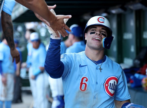 Chicago Cubs third baseman Matt Shaw (6) is congratulated in the dugout after scoring in the seventh inning of a game against the St. Louis Cardinals at Wrigley Field in Chicago on Sept. 26, 2025. (Chris Sweda/Chicago Tribune)