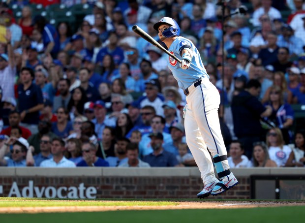 Chicago Cubs right fielder Seiya Suzuki watches the flight of his grand slam in the seventh inning of a game against the St. Louis Cardinals at Wrigley Field in Chicago on Sept. 26, 2025. (Chris Sweda/Chicago Tribune)