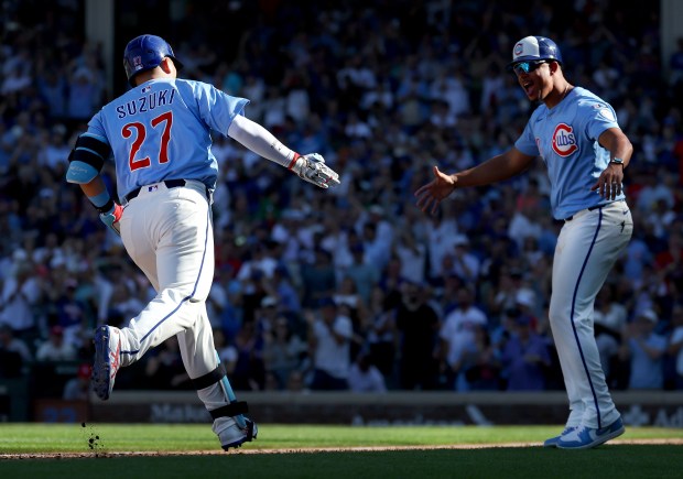 Chicago Cubs right fielder Seiya Suzuki rounds the bases after hitting a grand slam in the seventh inning of a game against the St. Louis Cardinals at Wrigley Field in Chicago on Sept. 26, 2025. (Chris Sweda/Chicago Tribune)